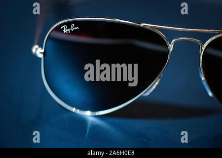 Gold Ray ban aviator sunglasses on a black background Stock Photo