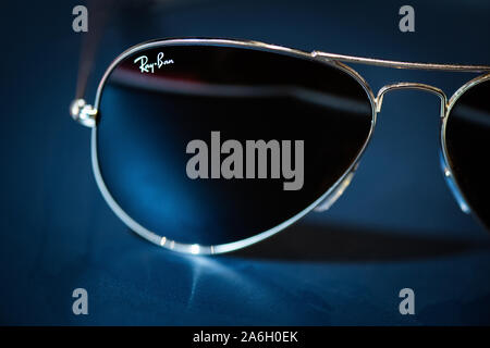 Gold Ray ban aviator sunglasses on a black background Stock Photo