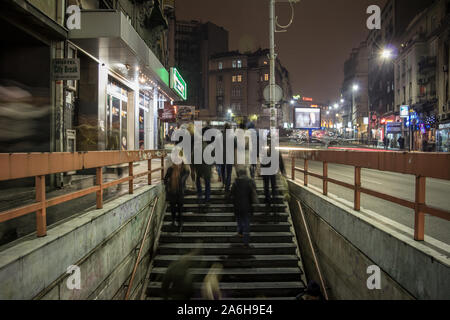 BELGRADE, SERBIA - DECEMBER 7, 2014: People in a rush walking, with a speed blur, on the stair, stairways and steps of the underground passage of Zele Stock Photo