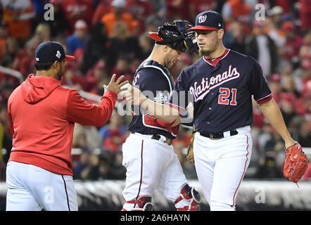 Washington, USA. 26th Oct, 2019. Washington Nationals manager Dave Martinez (L) relieves pitcher Tanner Rainey (21) against the Houston Astros in the seventh inning in Game 4 of the 2019 World Series at Nationals Park in Washington, DC on Saturday, October 26, 2019. The Nationals lead the series 2-1. Photo by Kevin Dietsch/UPI Credit: UPI/Alamy Live News Stock Photo