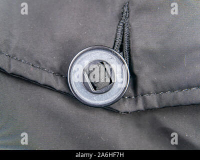 A large button on clothes. Clothing. Stock Photo