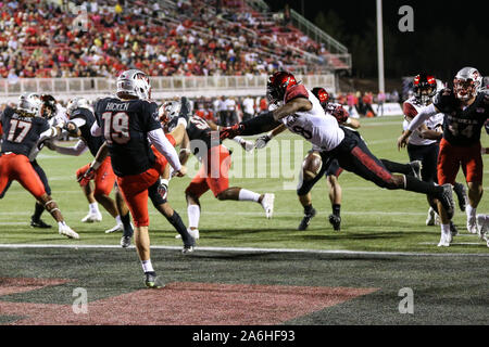 October 26, 2019: UNLV Rebels punter Hayes Hicken (19) has his kick blocked by San Diego State Aztecs safety Trenton Thompson (18) during the NCAA Football game featuring the San Diego State Aztecs and the UNLV Rebels at Sam Boyd Stadium in Las Vegas, NV. The San Diego State Aztecs lead the UNLV Rebels at halftime 17 to 7. Christopher Trim/CSM Stock Photo