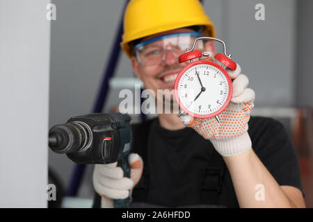 Man drilling hole in the woll early morning Stock Photo