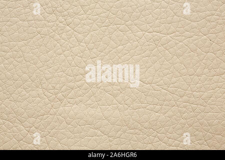 Relief leatherette texture in light beige tone. Stock Photo