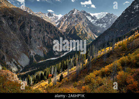 Beautiful landscape of mountain valley with river and autumn yellow forest in Kazakhstan, Almaty Stock Photo