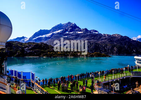 Glacier Bay, Alaska, with mountain in background and deck of cruise boat in foreground Stock Photo
