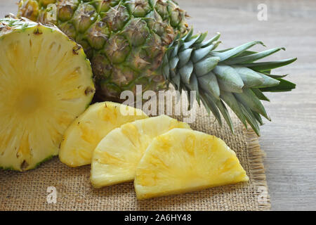 slices of  fresh pineapple on table top Stock Photo