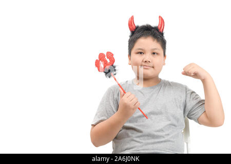 Handsome Fat boy with red horns and pitchfork isolated on white background, kid devil costume holiday party Stock Photo