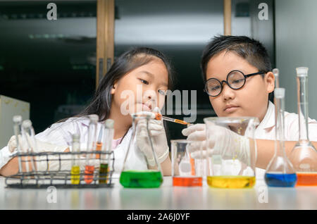 Happy two children making science experiments. Science and Education concept. Stock Photo