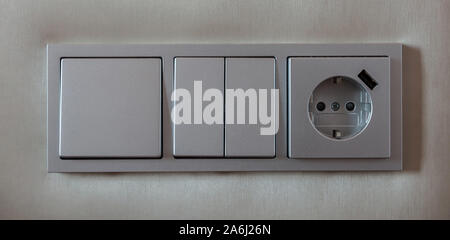 Electric socket and light switch panel, gray silver color,  Close up view with details, banner. Stock Photo