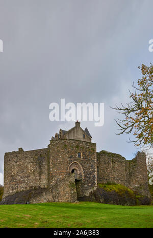 Dunstaffnage Castle near to Oban under heavy October skies on a wet afternoon, is one of Scotlands oldest Castles and owned by Historic Scotland. Stock Photo