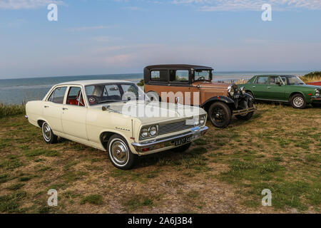 Vauxhall Cresta and Ford model A are seen during the every Monday retro cars owners meeting on the public beach in Hevringholm, Denmark on 29 July 2019  © Michal Fludra / Alamy Live News Stock Photo