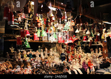 different handmade ceramic souvenirs displayed at the stand of the Christmas market, illustration on the theme of holiday shopping and tourism Stock Photo