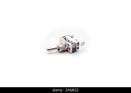 Automotive toggle switch on isolated white background. Automotive electric spare part. Stock Photo