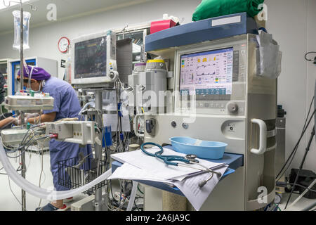 Nurse is using anesthesia Machine in hospital operating room. Stock Photo