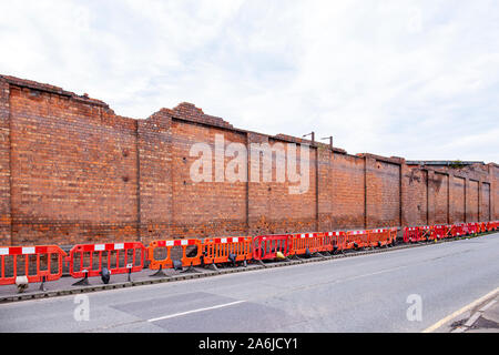 Crewe Works build trains behind those walls, soon to be demolished and making space for Coppenhall Place housing estate, Cheshire UK Stock Photo