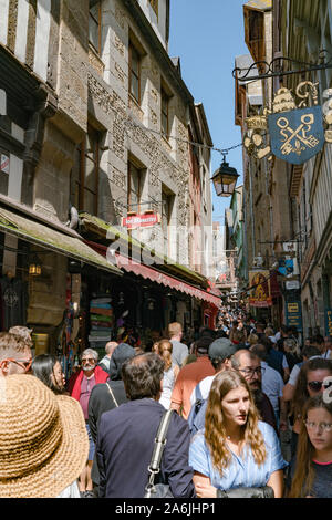 Le Mont Saint-Michel, Manche / France - 18 August 2019: bus transport for tourists visiting the famous Mont Saint-Michel in France Stock Photo