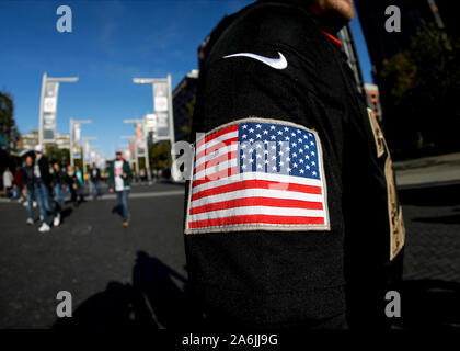 Wembley Stadium, London, UK. 27th Oct, 2019. National Football League, Los Angeles Rams versus Cincinnati Bengals; NFL fan arriving at Wembley Stadium wearing an NFL shirt with a United States of American flag patch on his arm - Editorial Use Credit: Action Plus Sports/Alamy Live News
