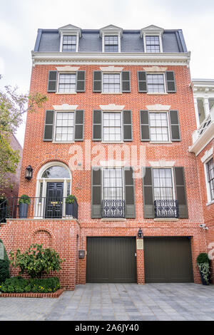 Georgian colonial style multi story luxury house with dormer windows and red brick facade in Georgetown Washington DC USA Stock Photo