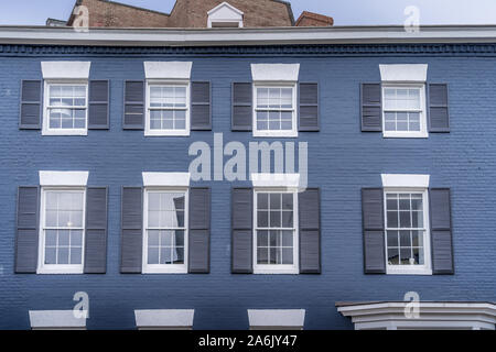 Georgian colonial style multi story luxury house with dormer windows and red brick facade in Georgetown Washington DC USA Stock Photo