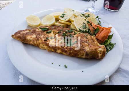 ham omelette with french fries and salad Stock Photo