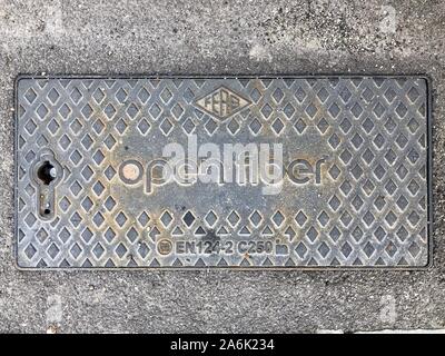 Torino, Italy - October 27 2019: Manhole of Open Fiber manhole, that aims to bring ultra wideband, UWB, optical fiber to all the major cities in Italy Stock Photo