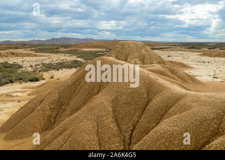 Sedimentary eroded mountains in the middle of the Spanish badlands Bardenas Reales Stock Photo