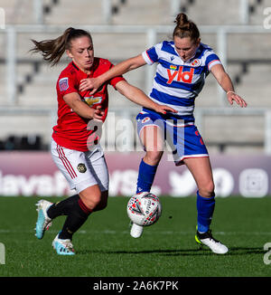 Leigh Sports Village, Lancashire, UK. 27th Oct, 2019. The FA's Women's Super League, Manchester United Women versus Reading Women; Kirsty Hanson of Manchester United tackles Rachel Rowe of Reading FC Women Credit: Action Plus Sports/Alamy Live News Stock Photo