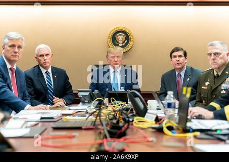 Washington DC, USA. 26 October, 2019. U.S President Donald Trump, center, watches from the White House Situation Room as Special Operations forces close in on ISIS leader Abu Bakr al-Baghdadi at compound in Syria October 26, 2019 in Washington, DC. Joining the president from left to right are: National Security Advisor Robert O’Brien, Vice President Mike Pence, Secretary of Defense Mark Esper and Chairman of the Joint Chiefs of Staff General Mark A. Milley.  Credit: Shealah Craighead/White House Photo/Alamy Live News Stock Photo