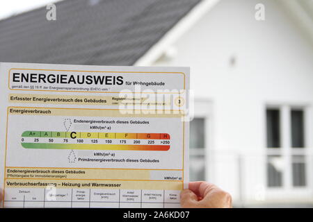 Energy label on a tablet with a house in the background Stock Photo