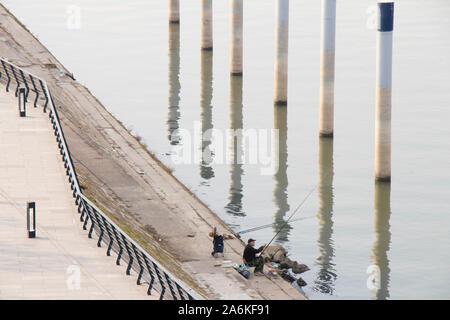 Belgrade, Serbia - October 17, 2019: Sava river promenade on Belgrade Waterfront in the autumn morning,  from above, and one man fishing Stock Photo