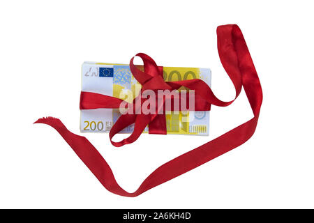 Present. Money tied with a red ribbon on a white background. Stock Photo