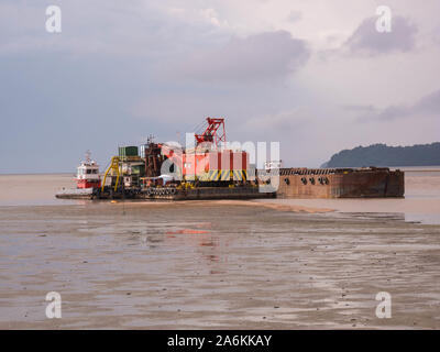 Sand barge in the middle of the sea Stock Photo