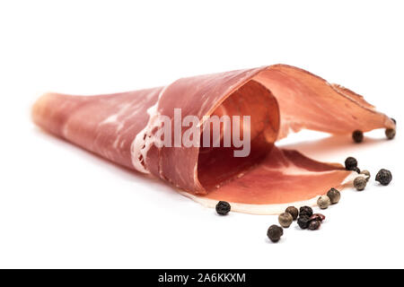 Swirl twisted thin sliced pork jamon slices isolated on white background Stock Photo