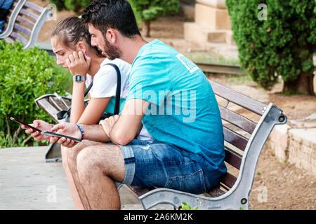 Barcelona Spain,Catalonia Catalunya,Montjuic,Avinguda Avenida de la Reina Maria Cristina,park bench,man men male adult adults,woman women female lady Stock Photo