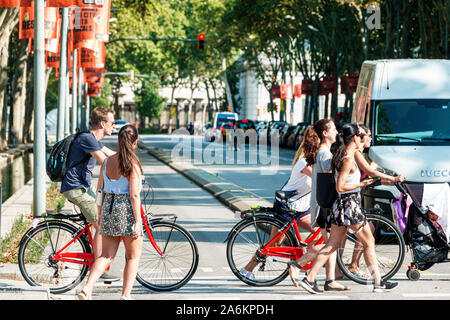 Barcelona Spain,Catalonia El Born,historic district,Ciutat Vella,street crossing,girl,man,teen,bicycle,walking,pedestrians,Hispanic,ES190822173 Stock Photo