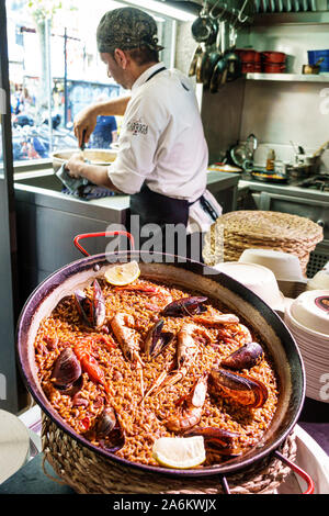 Barcelona Spain,Catalonia Ciutat Vella,Barri Gotic,La Rambla,Mercat de la Boqueria,public market,Paella Street restaurant,kitchen,chef,cooking,seafood Stock Photo