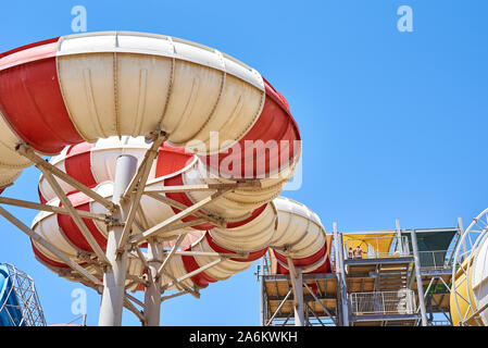 Close up of tube water slide in aqua park against blue sky Stock Photo