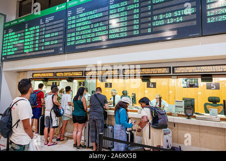 Barcelona Spain,Catalonia Barcelona-Sants Renfe Train Station,inside interior,passengers commuters,Rodalies ticket window counter,man,woman,line,queue Stock Photo