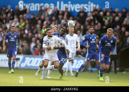 Swansea, UK. 27th Oct, 2019. Matt Grimes of Swansea city (l) and Omar Bogle (27) of Cardiff city in action. EFL Skybet championship match, Swansea city v Cardiff city at the Liberty Stadium in Swansea, South Wales on Sunday 27th October 2019. this image may only be used for Editorial purposes. Editorial use only, license required for commercial use. No use in betting, games or a single club/league/player publications. pic by Andrew Orchard/Andrew Orchard sports photography/Alamy Live news Credit: Andrew Orchard sports photography/Alamy Live News Stock Photo