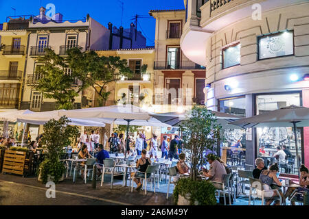 Valencia Spain Hispanic,Ciutat Vella,old city,historic center,Plaza del Mercat,Birra & Blues, restaurant,bar,night evening,al fresco dining,tables,umb Stock Photo