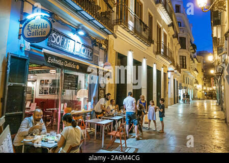 Valencia Spain Hispanic,Ciutat Vella,old city,historic center,pedestrian street,Sofartcafe, restaurant,bar,al fresco dining,night evening,man,woman,co Stock Photo