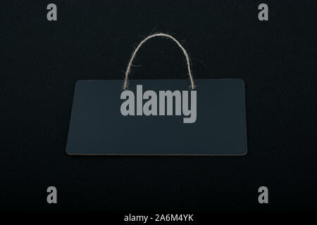 Rectangular shaped black notice board on black background Stock Photo