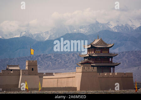 The Qilian Mountains behind the Jiayugian Fort, the ancient entrance to China after crossing the central Asian desert Stock Photo