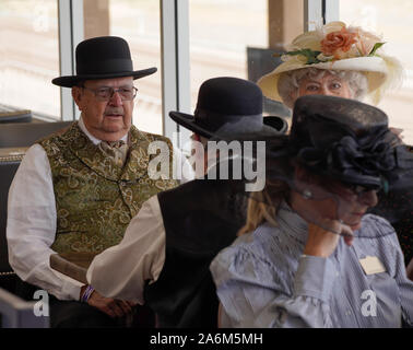 Senior Couples in period dress take us back to the turn of the century during a special event at the race track. Stock Photo