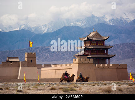 The Qilian Mountains behind the Jiayugian Fort, where camel caravans entered ancient to China after crossing the central Asian desert Stock Photo