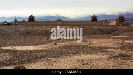 The Qilian Mountains behind the Jiayugian Fort, where camel caravans entered ancient to China after crossing the central Asian desert Stock Photo