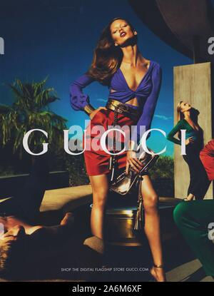 poster advertising GUCCI fashion house in paper magazine from 2011 year, advertisement, creative GUCCI 2010s advert Stock Photo