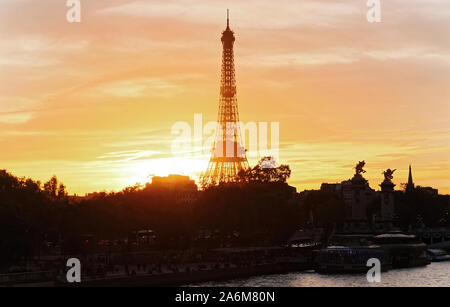The Eiffel Tower at Sunset, Paris, France.It is the most popular travel place and global cultural icon of the France and the world. Stock Photo