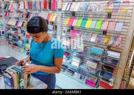 Barcelona Spain,Catalonia Les Corts,L'illa Diagonal,shopping mall,kiosk,smartphone personal device accessories,display sale,inside interior,employee,w Stock Photo